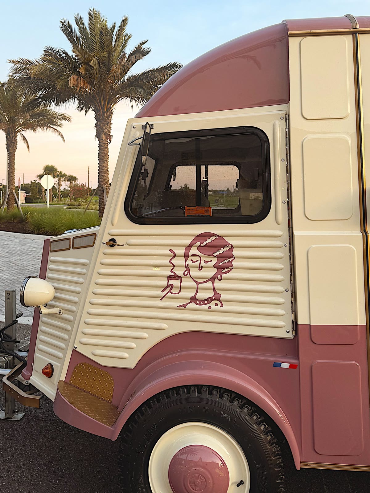 The illustrated Betty on the trailer door, palm trees behind